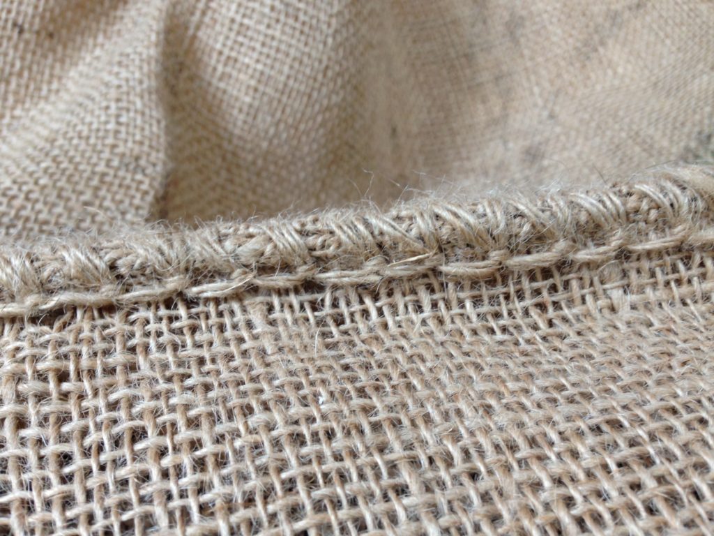 Stitching on burlap coffee sack